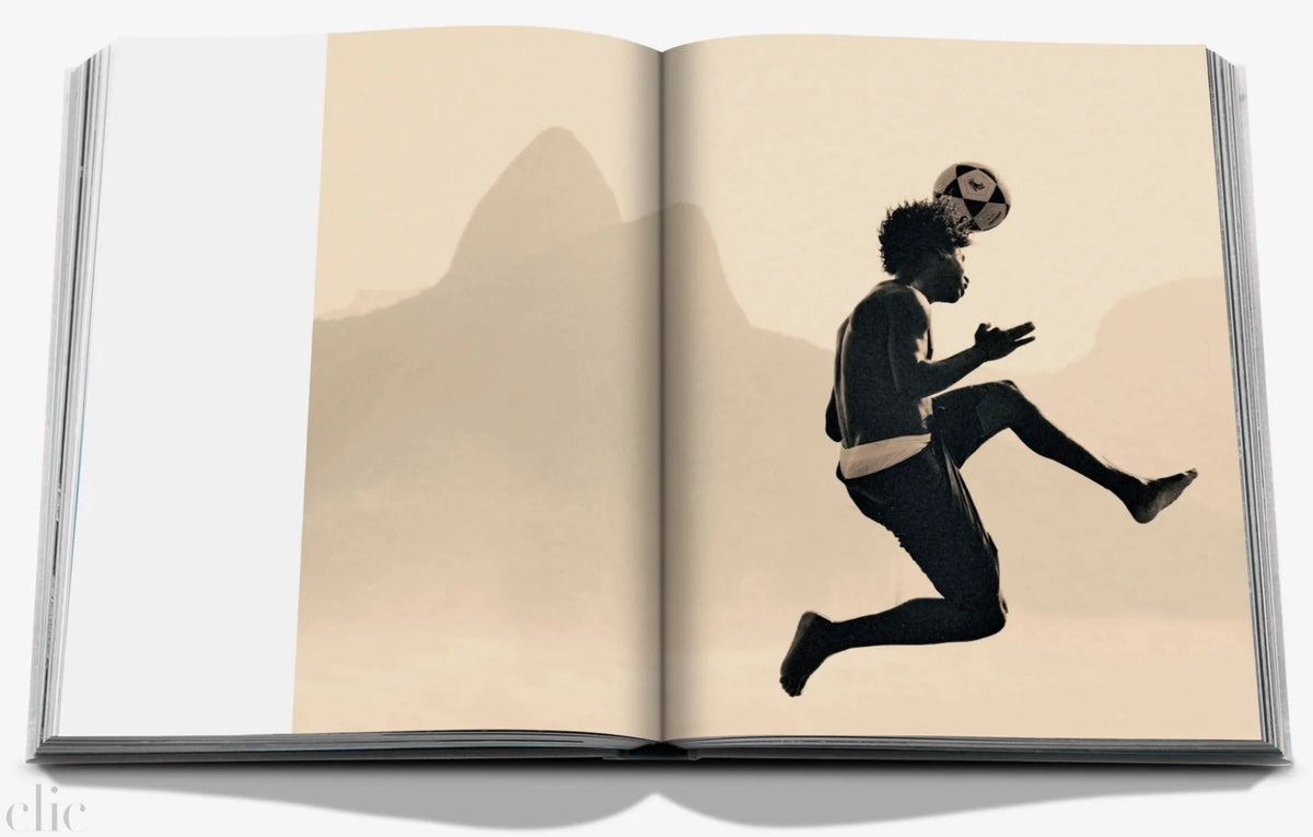 Open book with a silhouette of a person running on a mountainous background