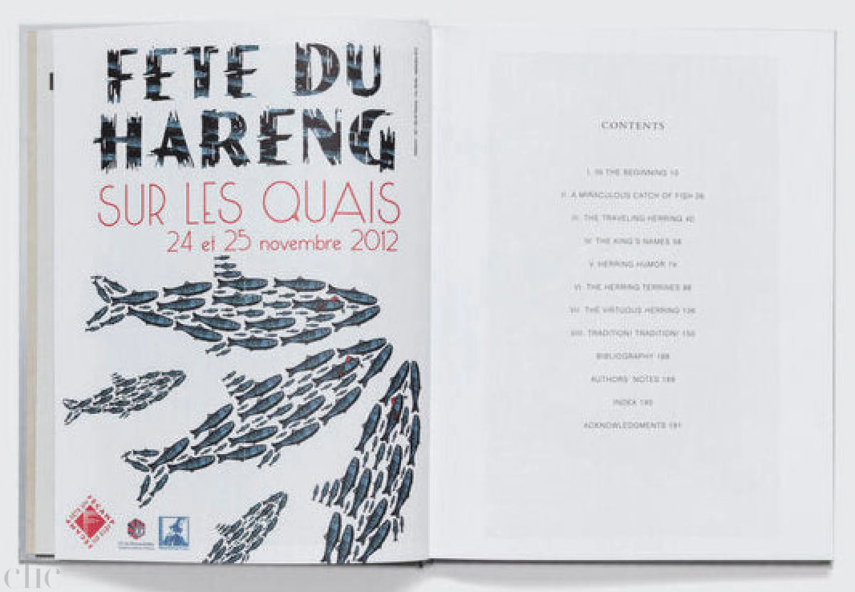Open book with text and fish illustrations on a white background