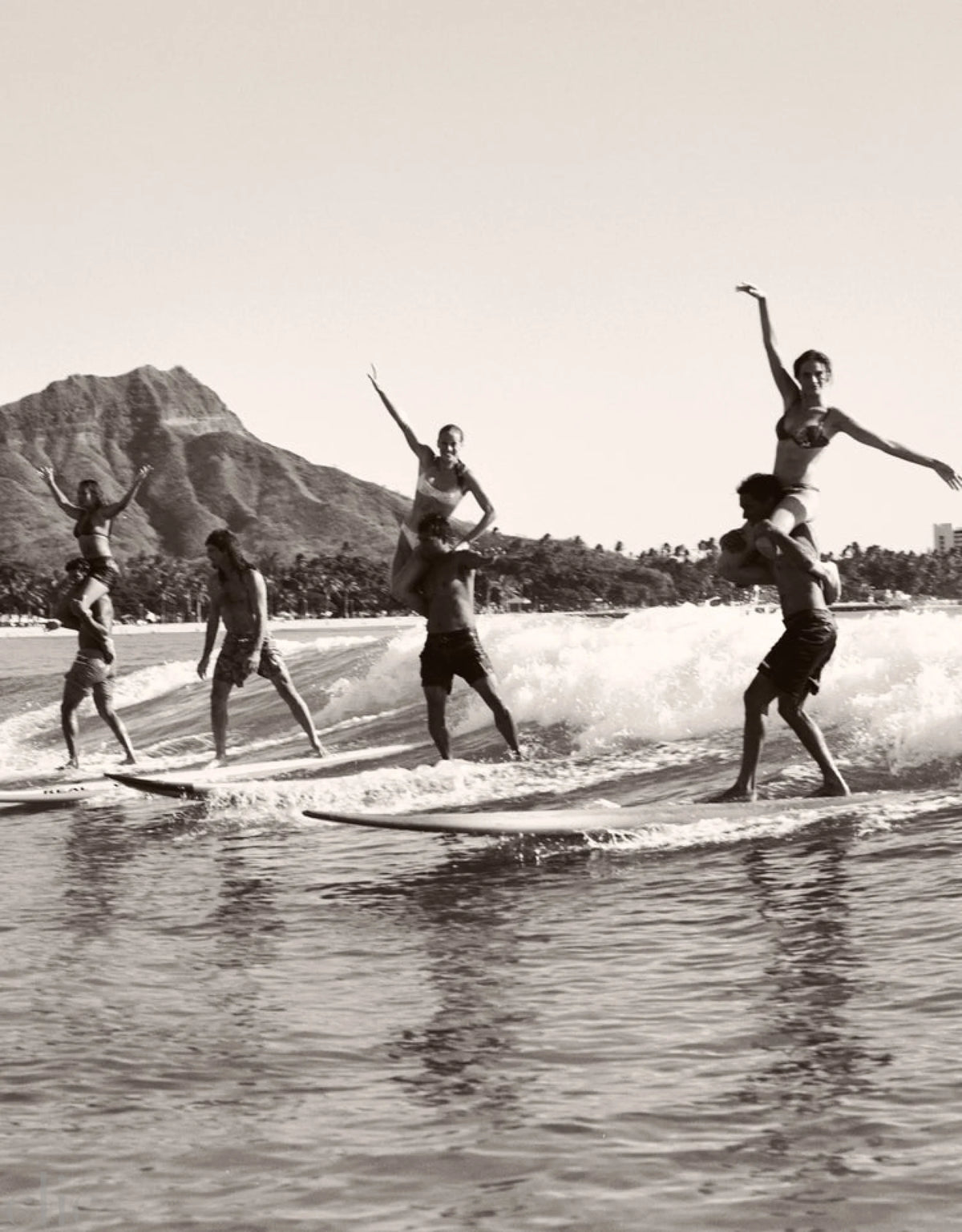 Brian Keaulana and Missy Rayder Tandem Surfing Diamond Head by Anne Menke