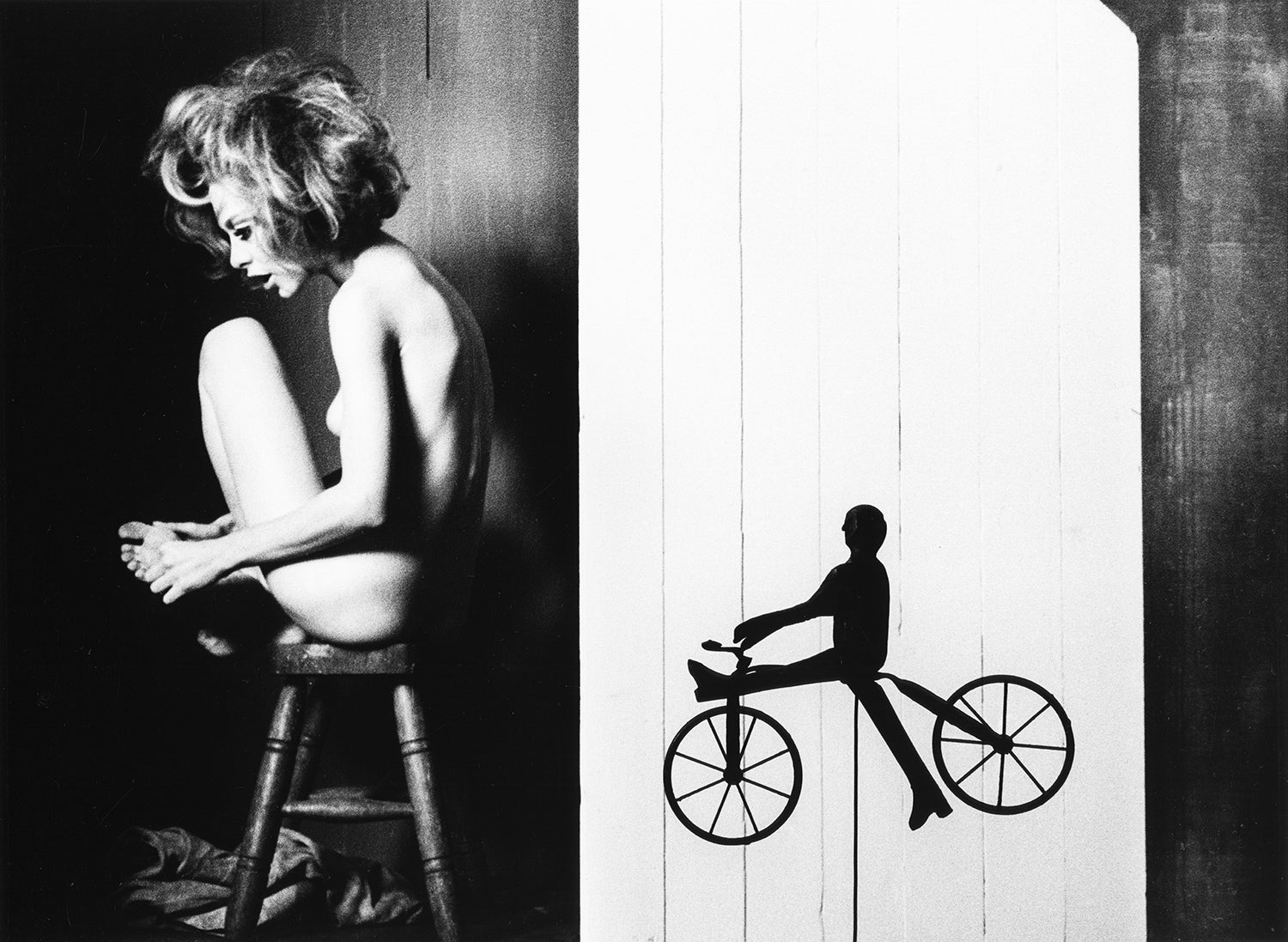 Kate On Stool with Toy Bike by Sam Haskins