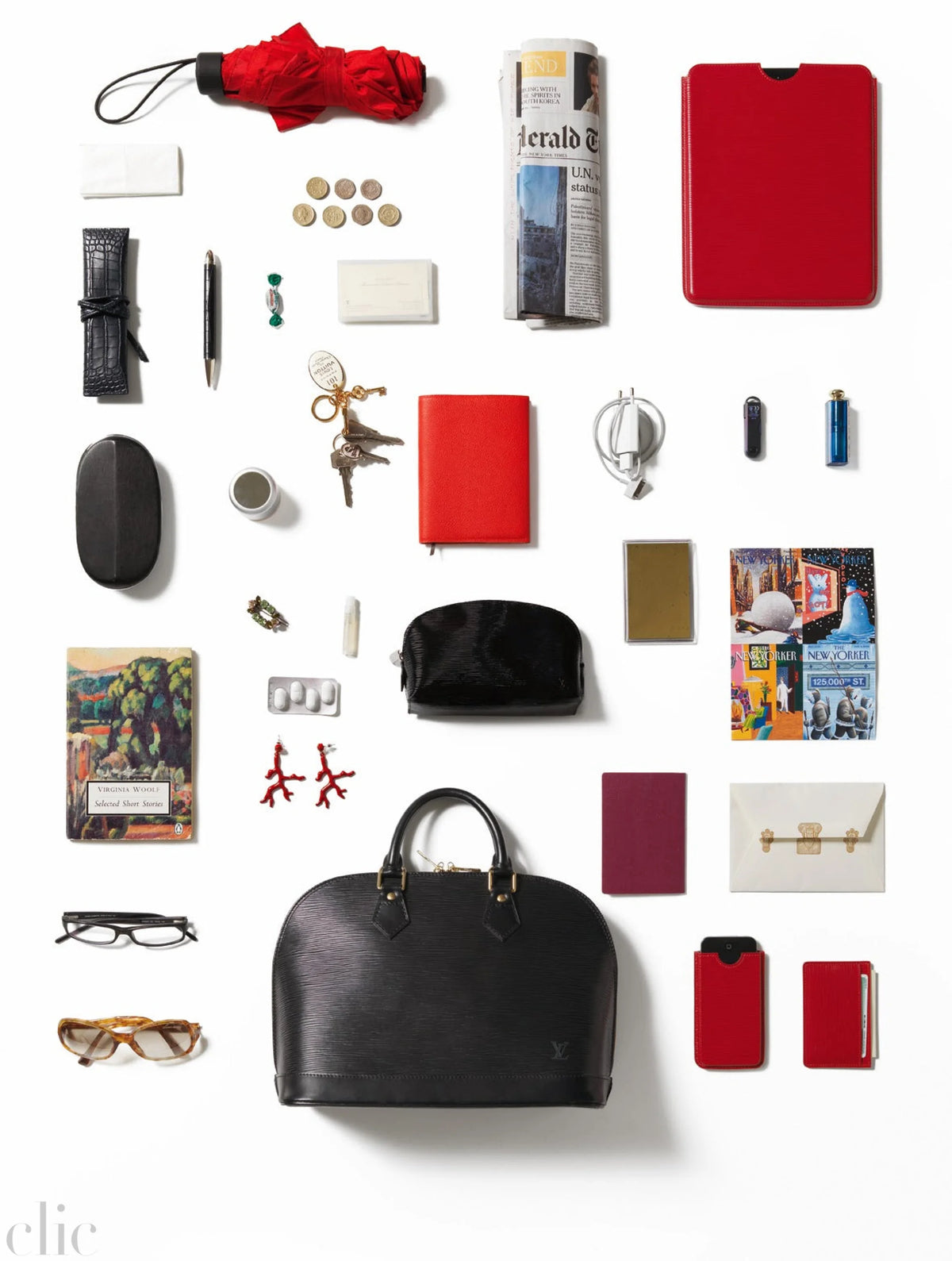 Collection of various items including a black handbag, red and black items, and other small objects on a white background.