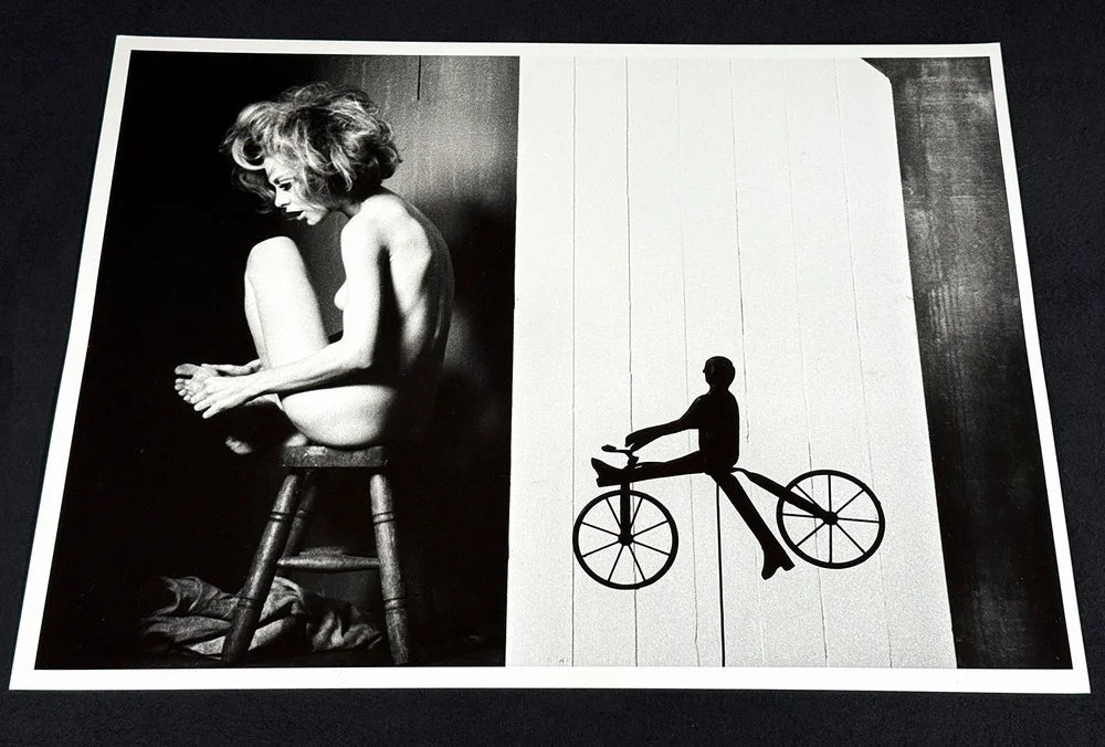 Kate On Stool with Toy Bike by Sam Haskins