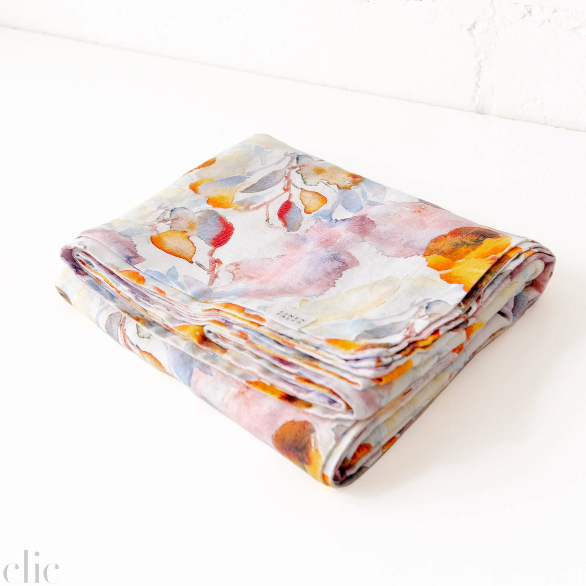 Orange Flow Tablecloth on White Linen, from Linen Tales