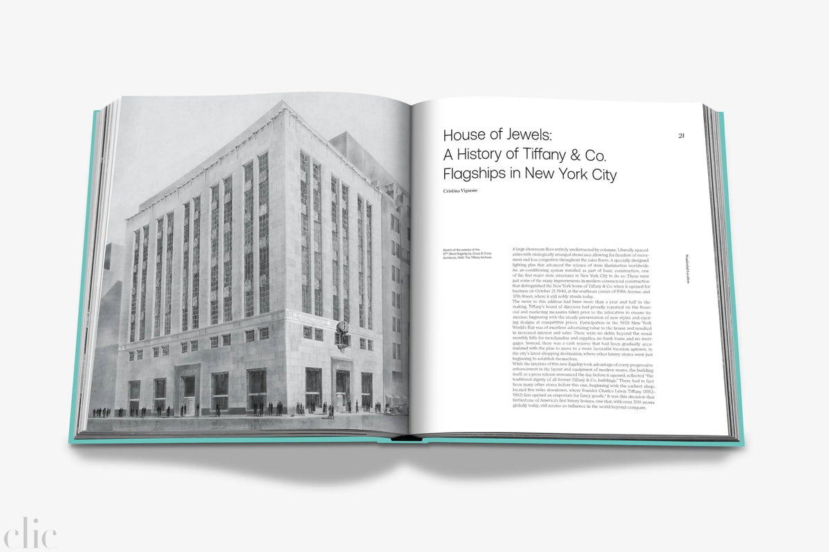 Open book showing a black and white photograph of a building and text on a white background