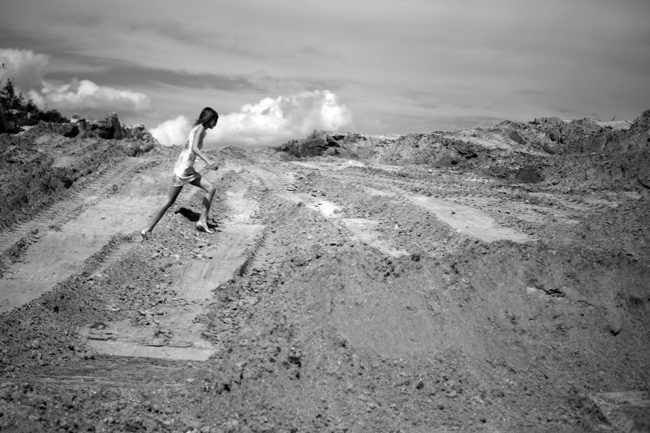 Lauren on sand pile by Charity de Meer