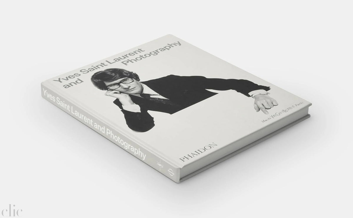 Book titled 'Yves Saint Laurent and Photography' on a white background