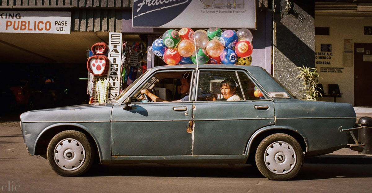 Car with Baloons by Josh Soskin