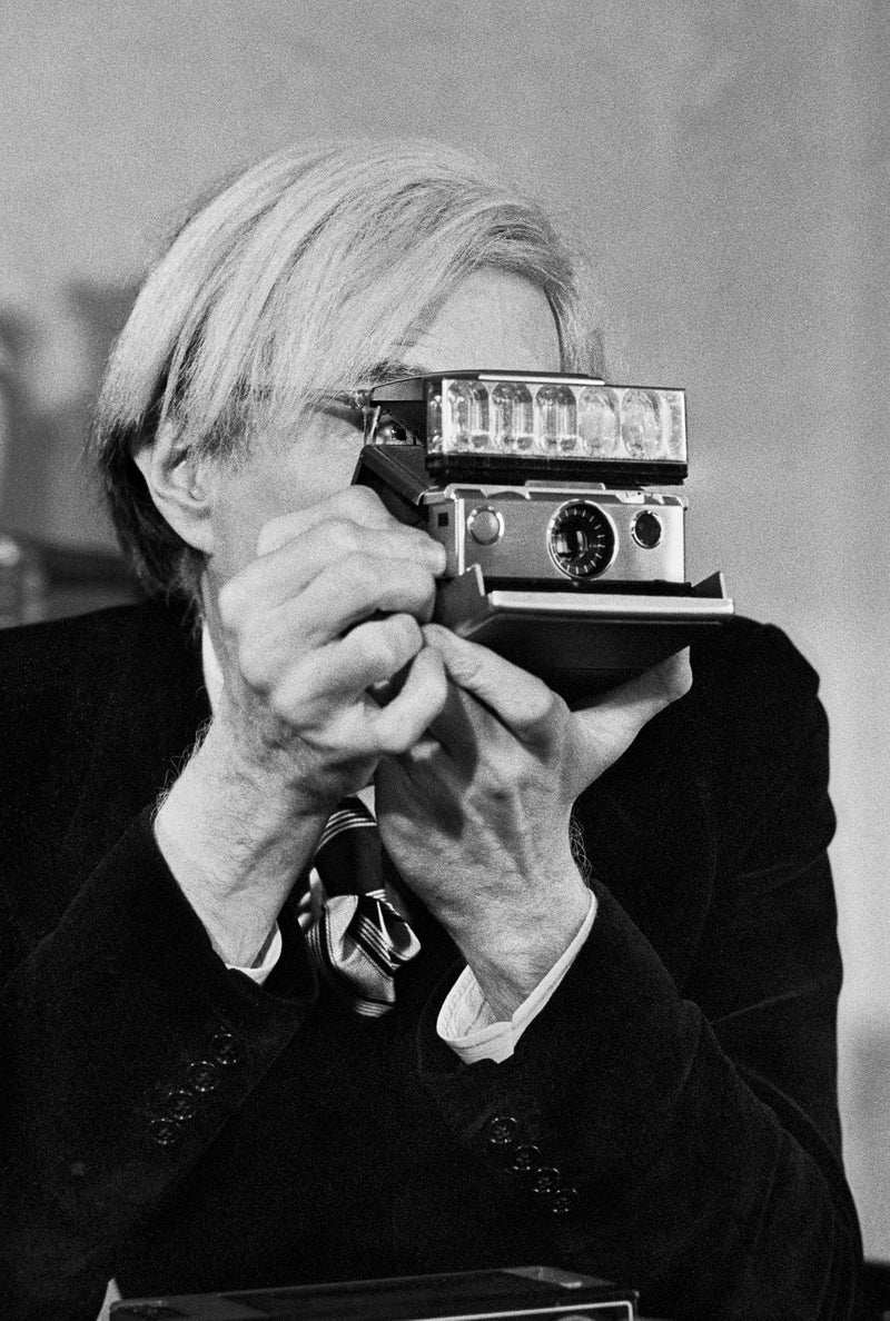 Andy Warhol & Polaroid I by Jean Pierre Laffont