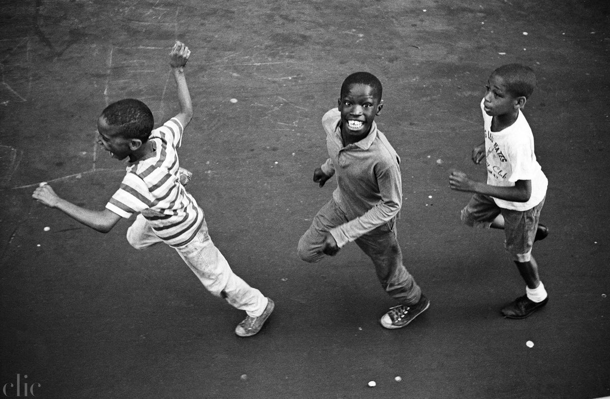 "Kids in Harlem Running After The Jazz Truck" by Jean Pierre Laffont