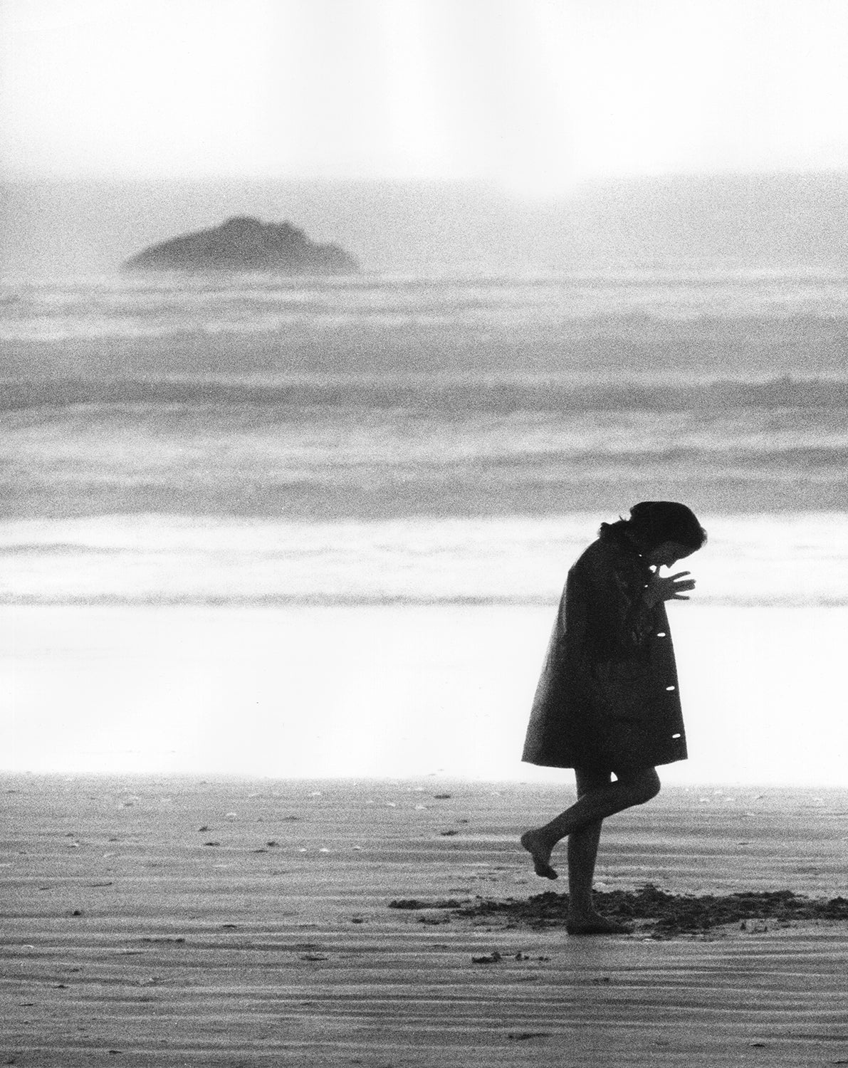November Girl - Pensive on the beach by Sam Haskins
