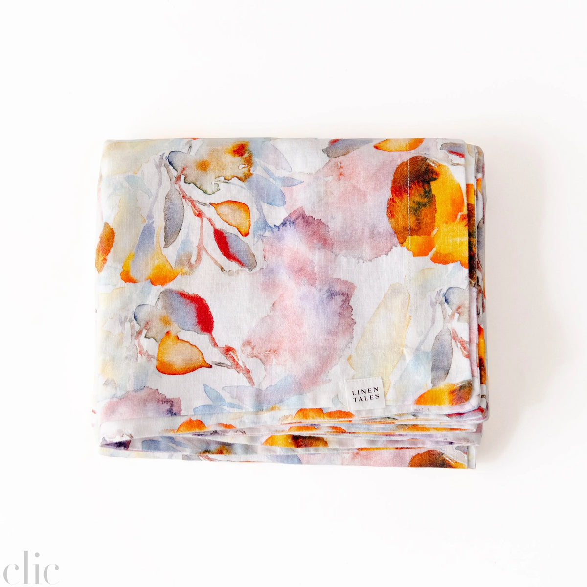 Orange Flow Tablecloth on White Linen, from Linen Tales