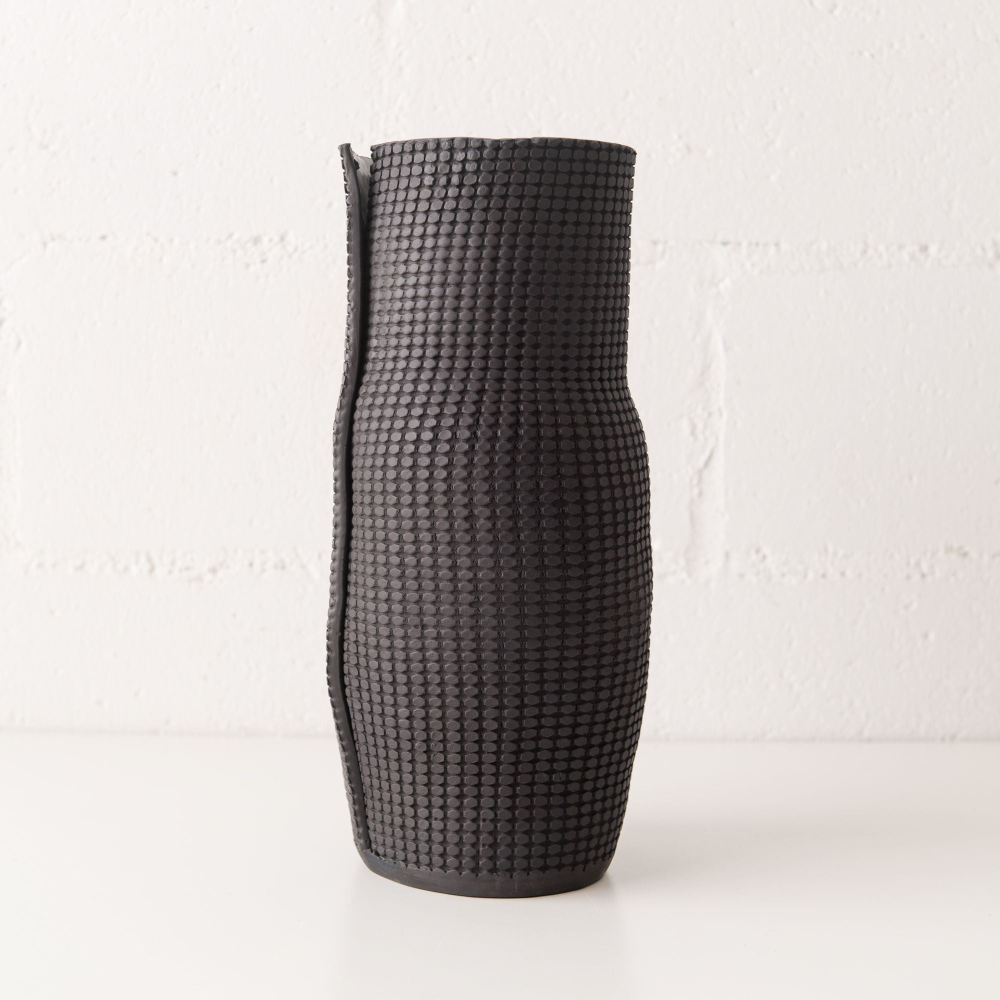 Grid Bottle Vessels in Black, from CYM Ceramics