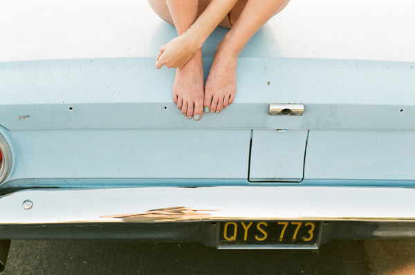 Feet On A Car by Josh Soskin