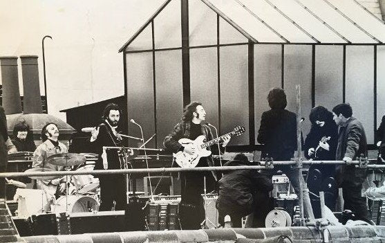 Beatles on rooftop by Richard Imrie