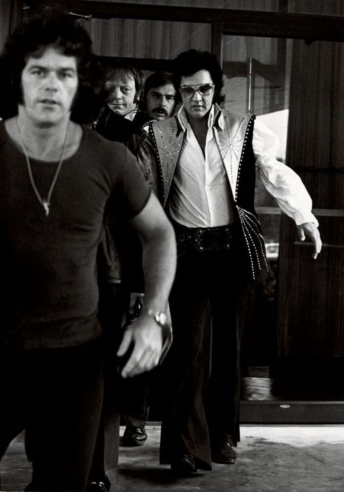 Elvis with bodyguards by Ron Galella