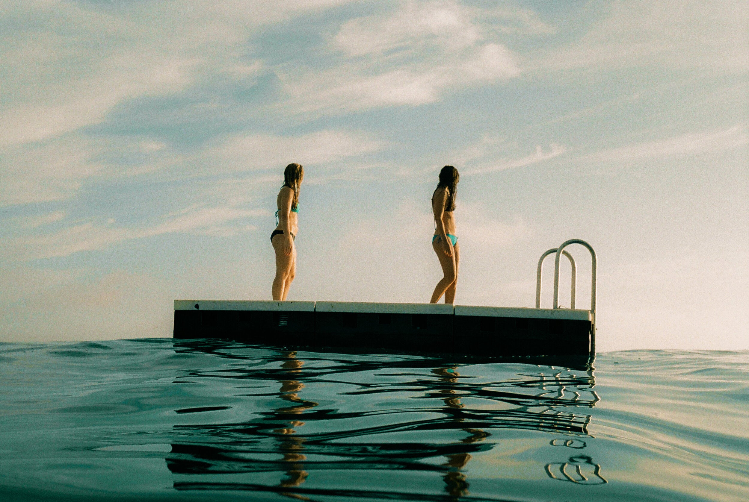 Girls On The Dock by Josh Soskin